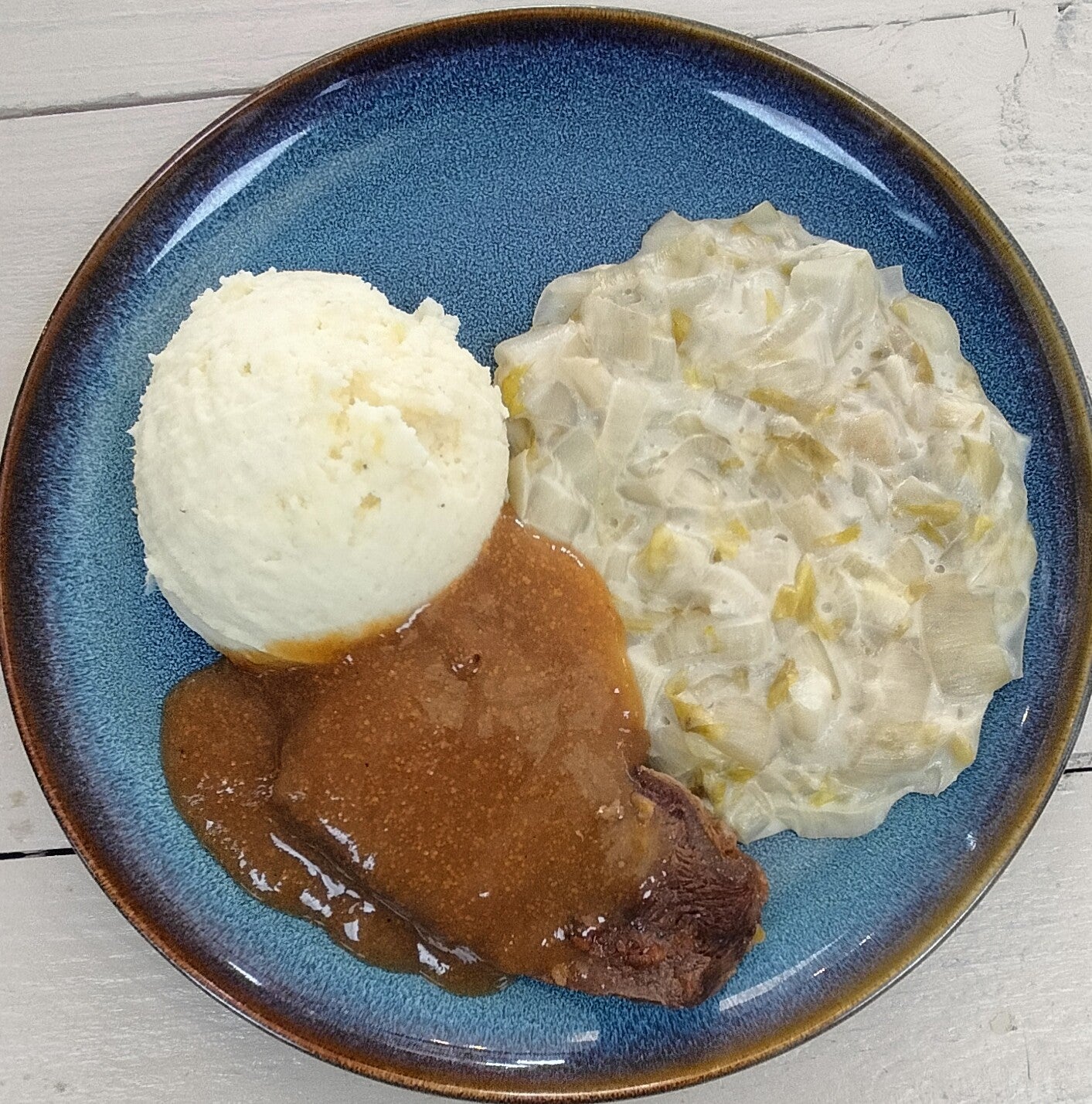 Runder draadjesvlees, jus, witlof a la creme, aardappelpuree