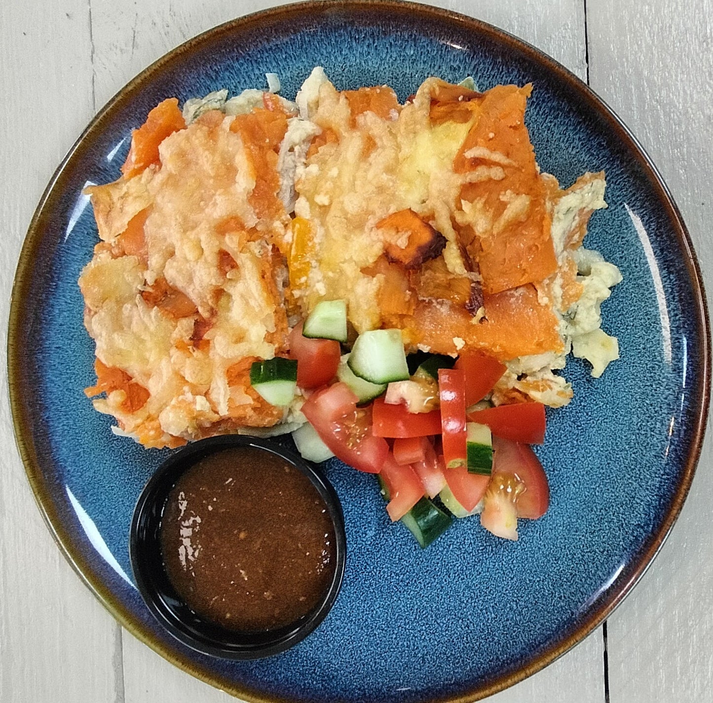 Ovenschotel v. Kip, zoete aardappel, prei, paprika, en jus